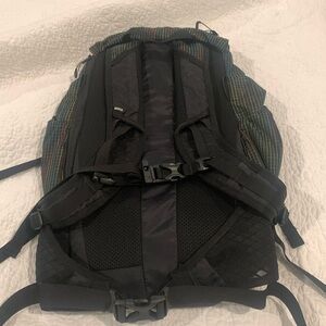 REI Flash22 Backpack. Black with colored lines throughout. Lightly used